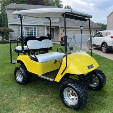 Yellow Ezgo TXT Electric custom golf cart