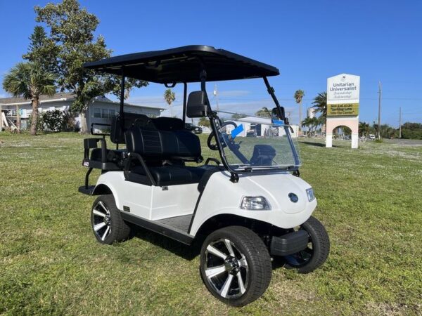 Pearl White 2025 Evolution Electric Vehicles Classic 4 Plus.